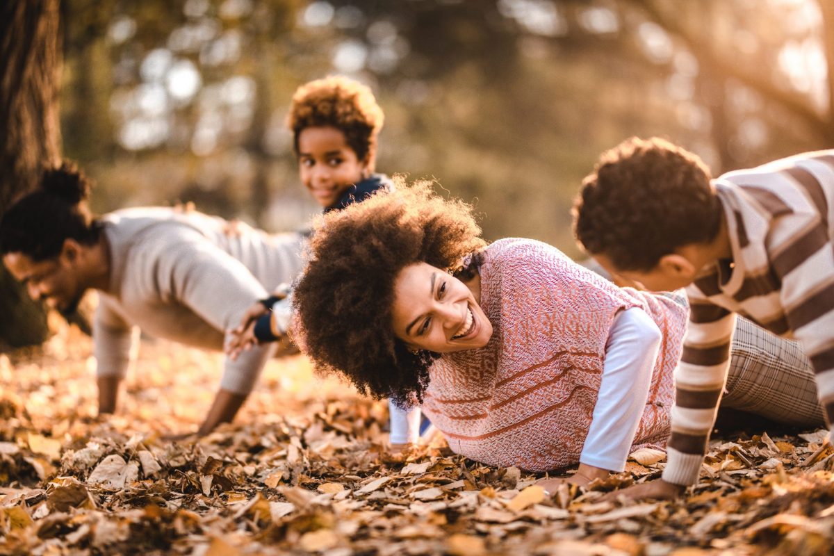 Happy family: mother, father, children son and  daughter on nature  on sunset