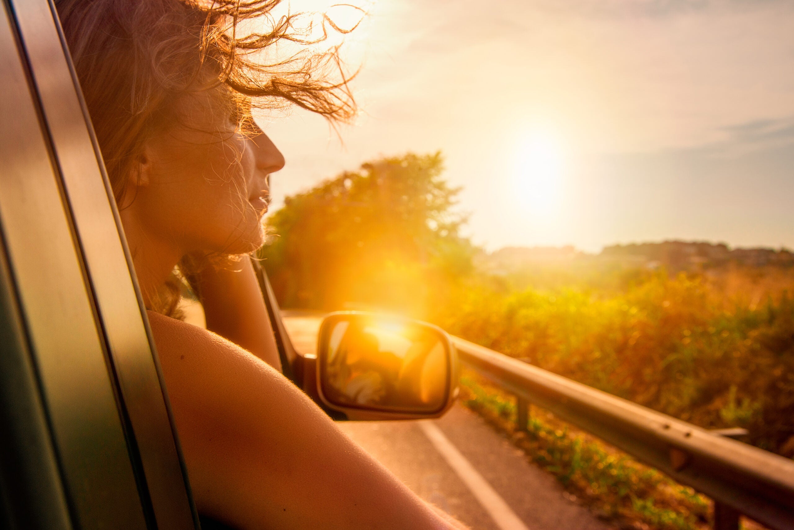 car travelling adventure female out of window