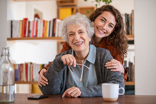 daughter embracing senior mom