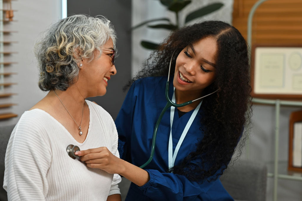 nurse checking patient heart rate