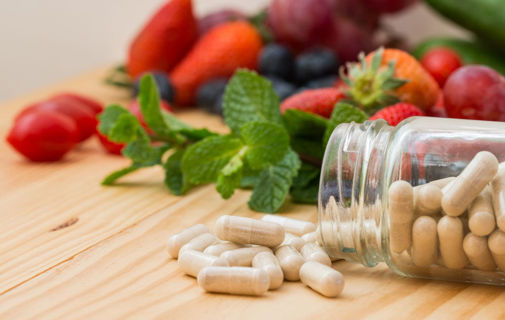 vitamins supplements bottle wooden table