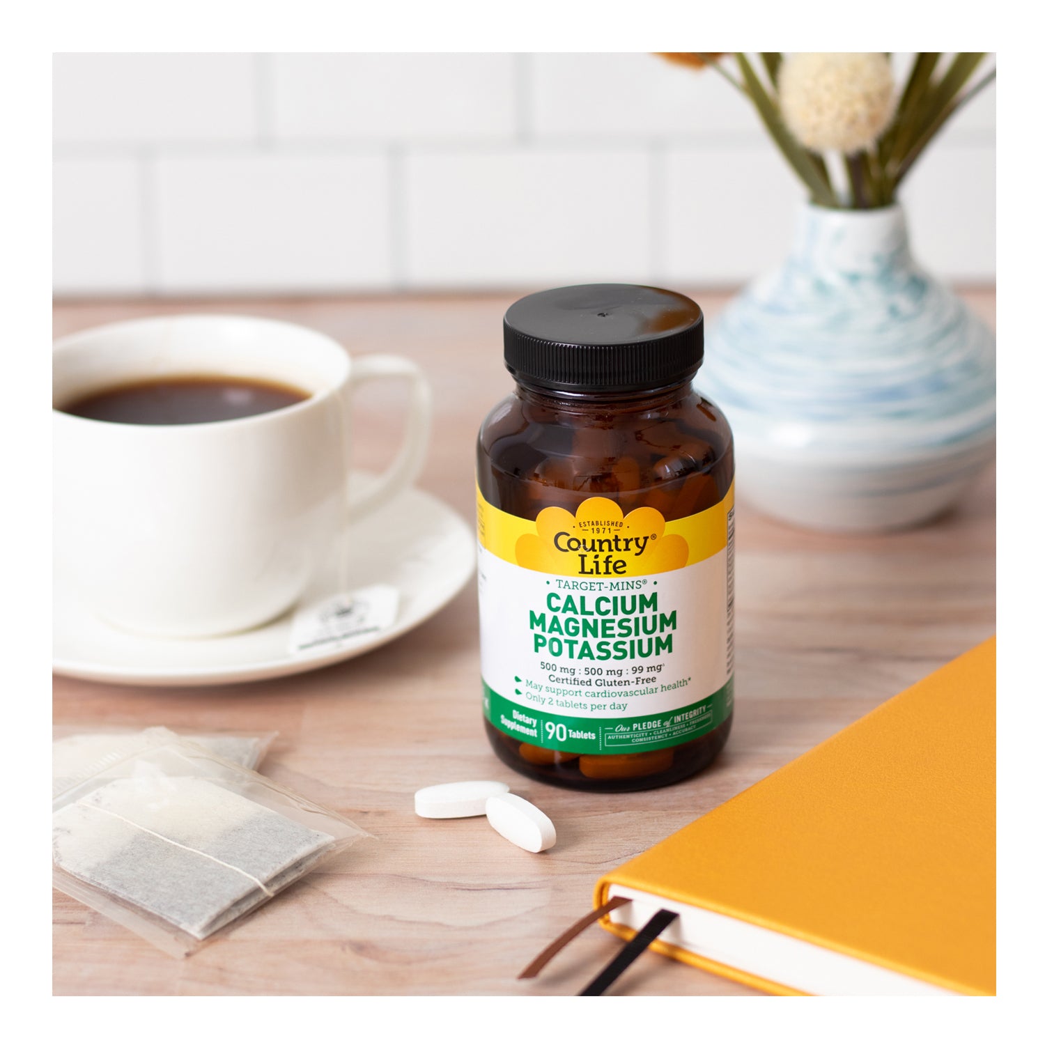 Target-Mins Calcium Magnesium Potassium on table with a cup of tea