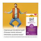 Man jumping joyfully with Country Life Gut Connection Stress Balance supplement packaging on a yellow background